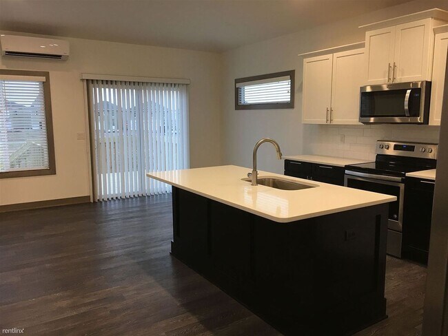 Building Photo - Spacious 4 bedroom/3 bath home with finished lower level and attached 2 car garage