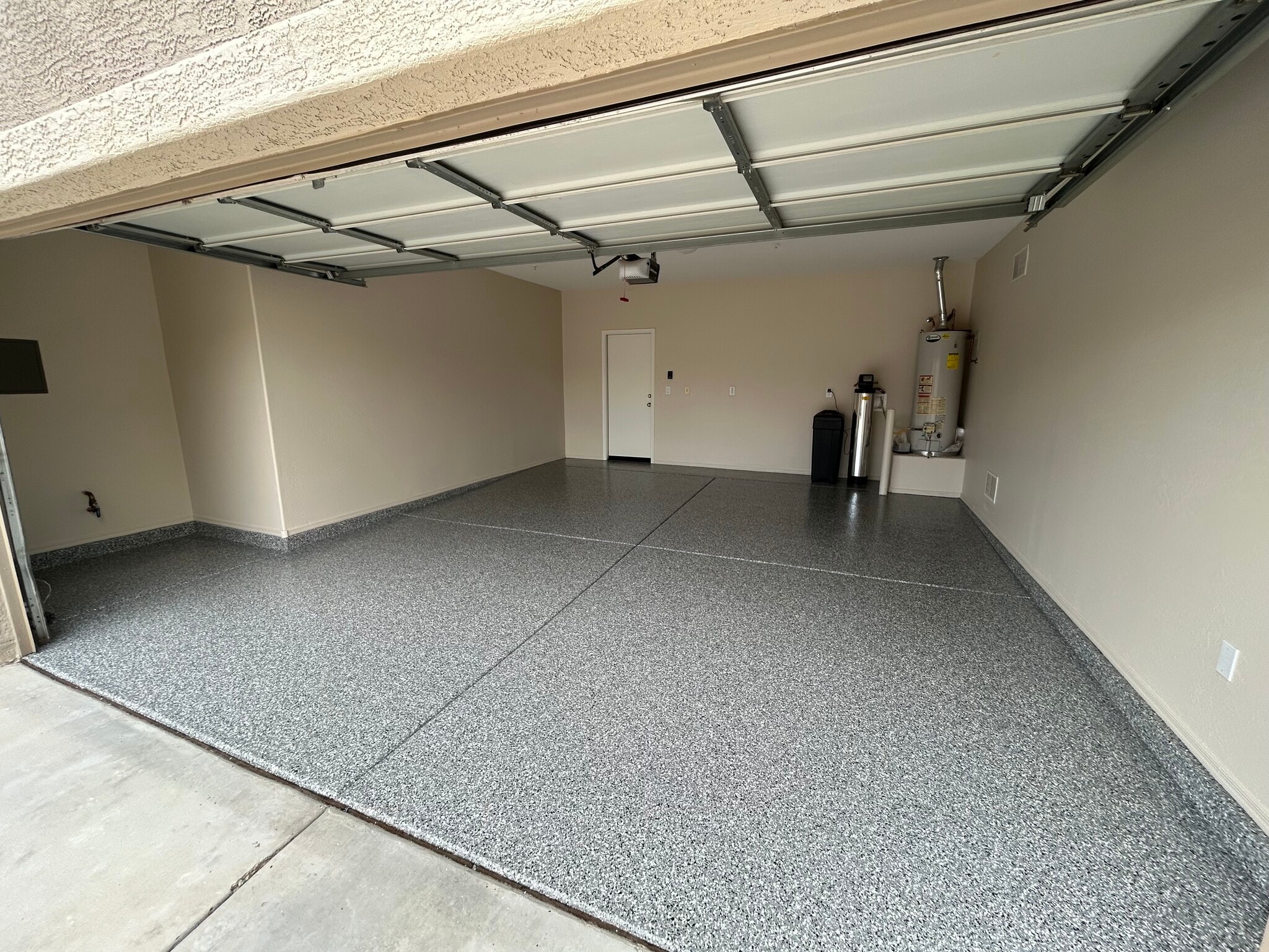 Garage with new epoxy flooring and water softener - 1879 W Owens Way