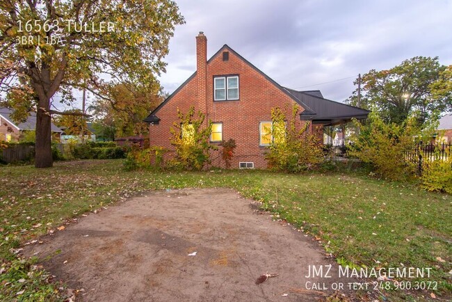 Building Photo - Welcome to this charming brick three-bedro...