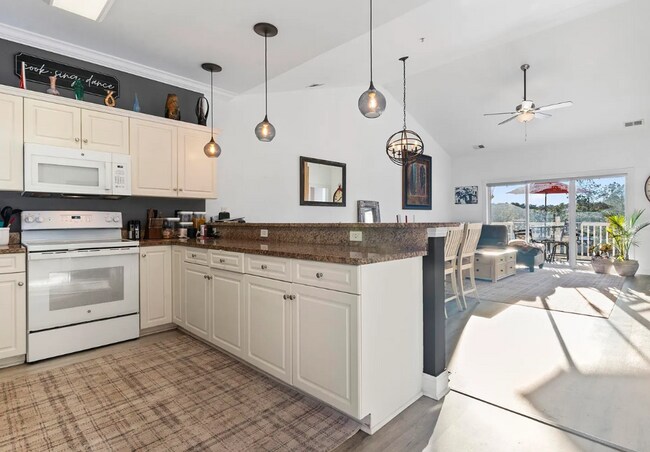 Building Photo - Stunning Top-Floor 2-Bedroom Retreat with Serene Pond Views!