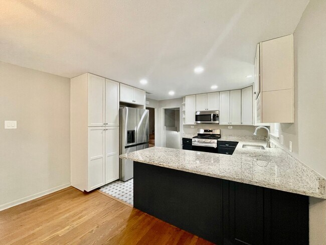 Building Photo - Updated Home w/ 2 Car Garage, Backyard and...