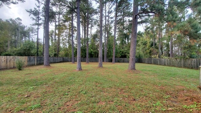 Building Photo - Newly Renovated 3 bedroom, 2 bath unit with fenced in yard and 2 car garage. Recently Reduced to ...