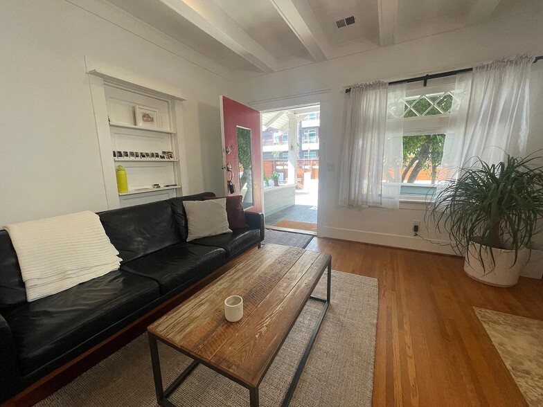 Inviting living space with wide front door that opens to a sunny, private yard. - 6000 Carlton Way