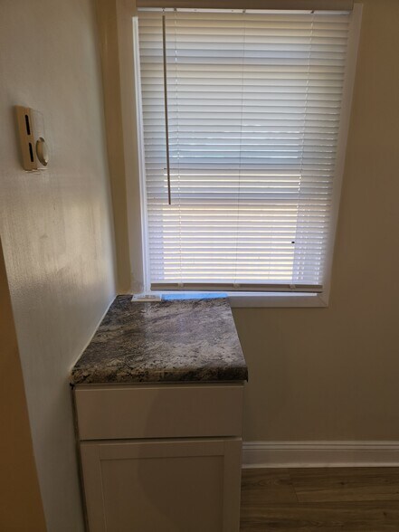 Separate charging station, enclosed trash cans - 1424 Avenue A