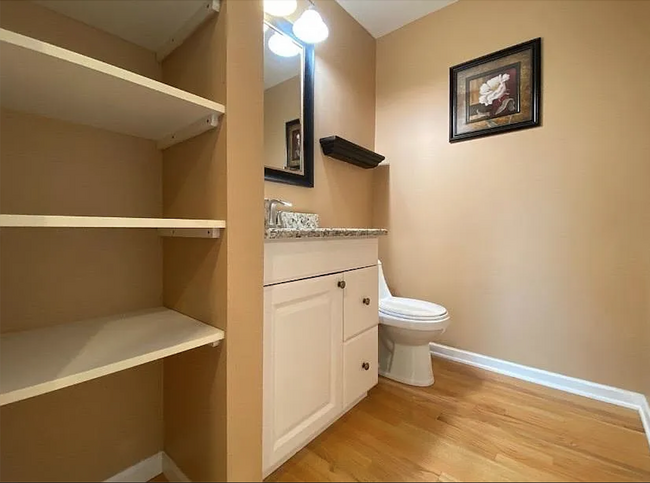 Master half bath with linen storage - 940 E Old Willow Rd