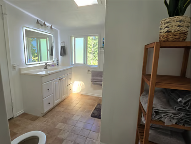 Bathroom with heated, light up vanity mirror - 1512 17th Ave S