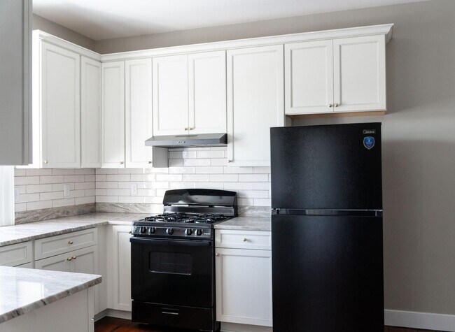 Building Photo - Renovated One-Bedroom Gem Steps from Train, Dining & Shopping