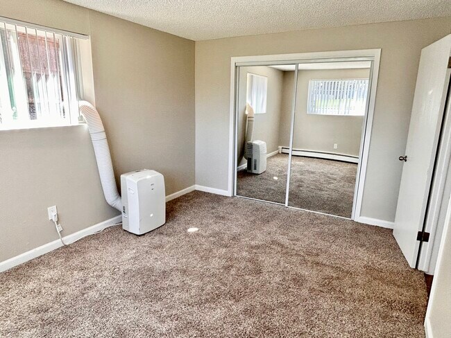 Experience comfort in this well-designed bedroom, featuring ample natural light and modern amenities. - 5381 Delaware