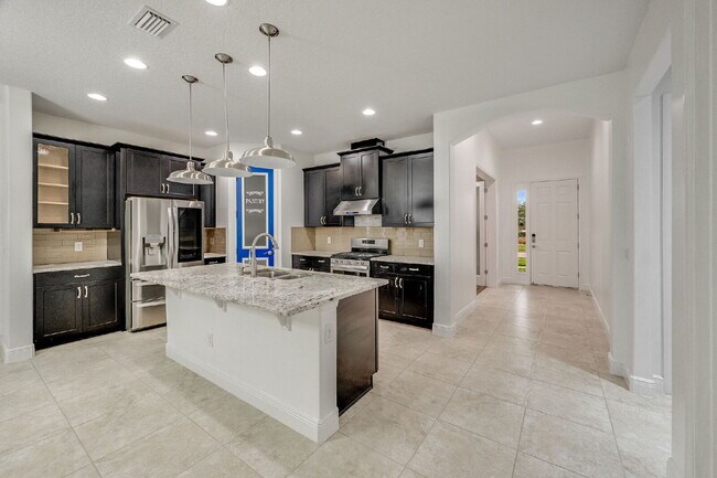 Building Photo - 4BR, 2.5BA home with resort style outdoor living!