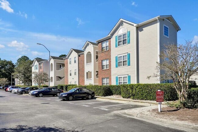 Building Photo - RENT SPECIAL! Freshly Painted! New Luxury Vinyl Plank Floors! Updated Lighting! Pool View Unit! C...