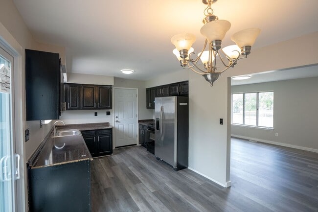 Building Photo - Must see FOUR bedroom Trilevel home