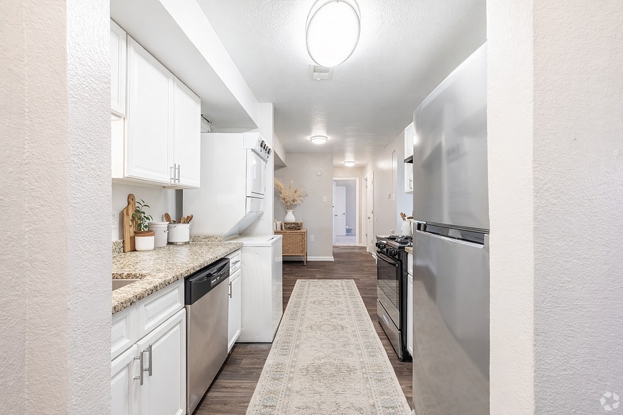 Modern galley-style kitchen with sleek design - Aubrey Apartments