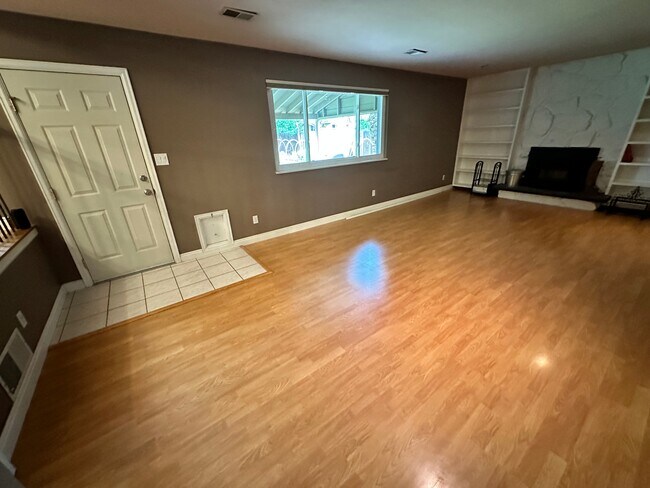Large family room window, looking out over the covered patio and the garden - 7393 S Washington Cir