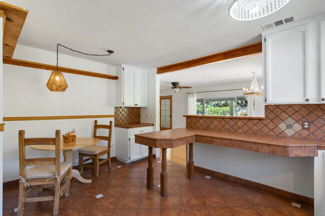 Breakfast and kitchen, lots of counter space, custom area for microwave - 228 N Pueblo Ave