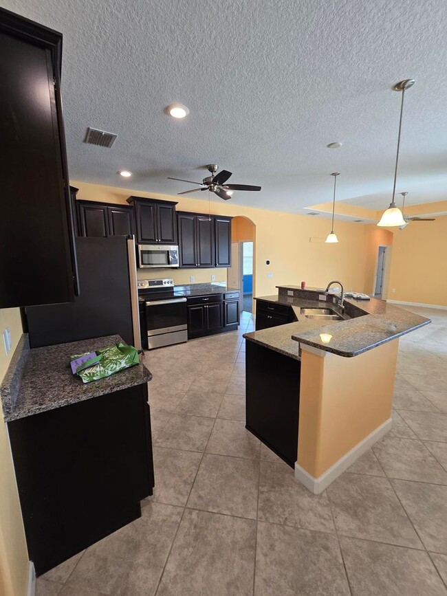 Building Photo - Gorgeous 4-Bedroom, 3-Bathroom Pool Home i...