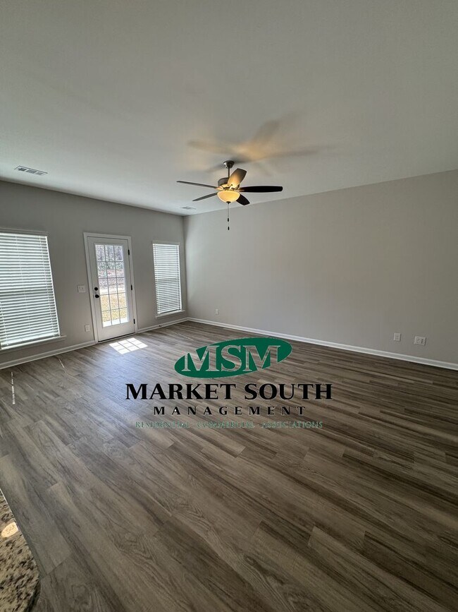 Building Photo - NEW CONSTRUCTION WITH PRIVACY FENCED YARD