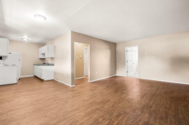 Experience the openness and warmth of this inviting apartment interior. - 1690 EATON