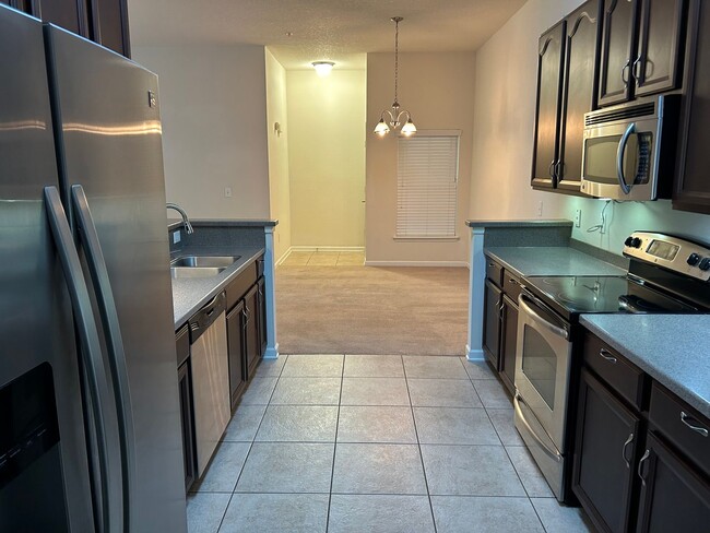 Building Photo - 2 Bed 2 Bath Condo in Gated Community with Balcony Views! Plenty of Amenities, Washer & Dryer and...