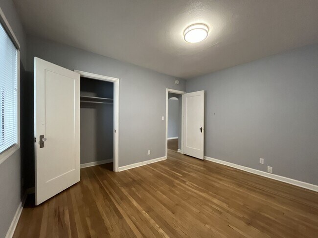 Building Photo - Three-Bedroom Home with Updated Kitchen & Vaulted Ceilings, large open basement, Hardwood floors