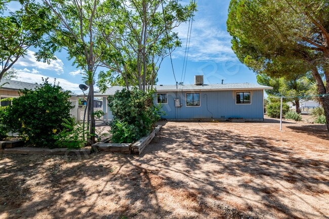 Building Photo - LARGE FENCED YARD WITH DETACHED GARAGE