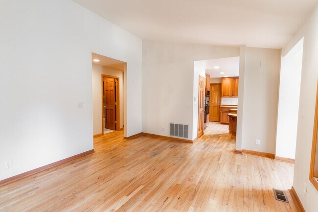 Building Photo - Private river access and stunning views from this home on Harmon Blvd! + Bonus Room