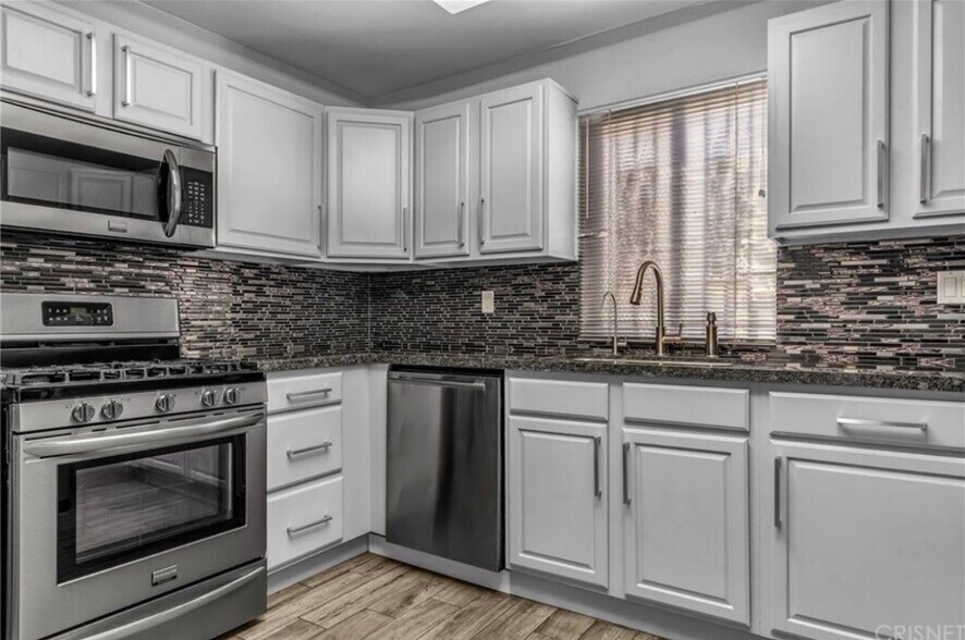 Building Photo - 6036 Hazelhurst Pl