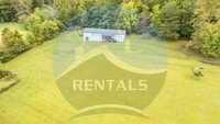 Building Photo - 4 bedroom 2 bath Double-Wide Trailer taste...