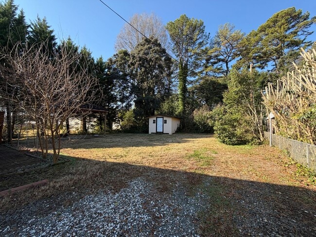 Building Photo - Freshly Painted Split-Level Home with Large Deck & Lawn Care Included