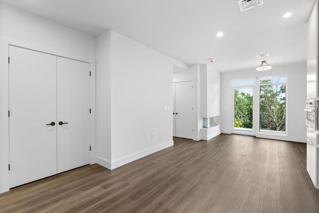 Building Photo - 2 Bedroom Corner-Unit with Wooded Balcony ...