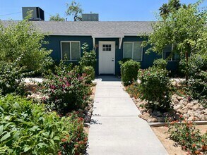 Building Photo - Boutique Living Meets Private Backyards an...