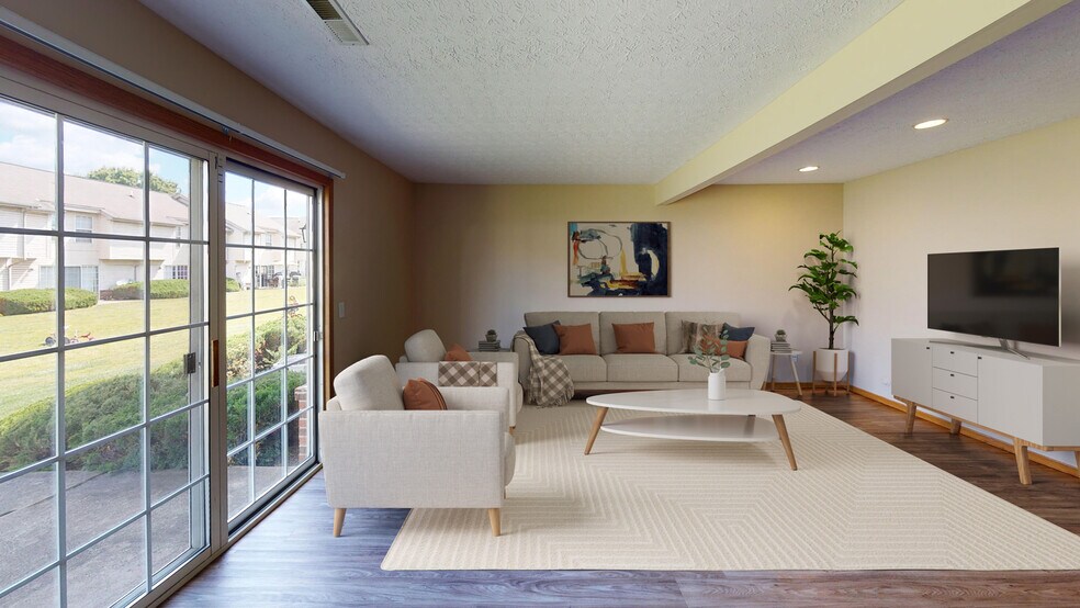 Spacious Living Room with Patio - Hilliard Park Apartments