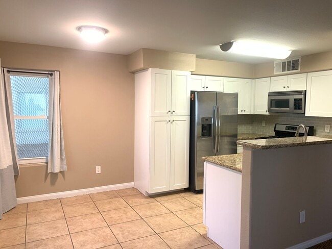 Building Photo - Thrive in this upgraded first-floor two be...