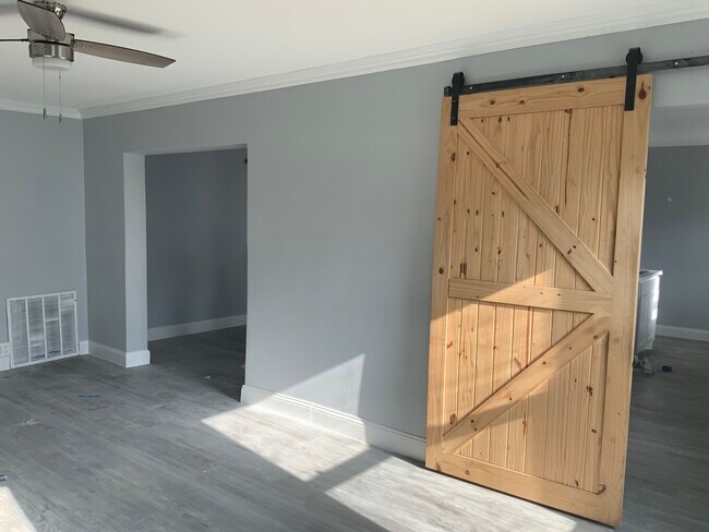 Sunroom opens to open concept living and kitchen - 3816 Byers Ave