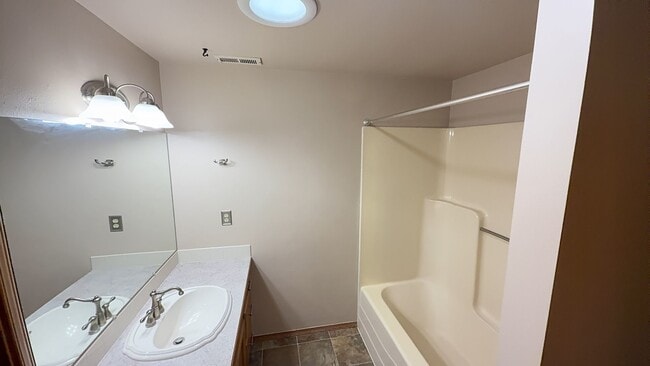 Building Photo - 4bd/3ba HUGE Home w/Hardwood Floors, Russian Fireplace, 2-Car Garage & Fenced Back Yard!