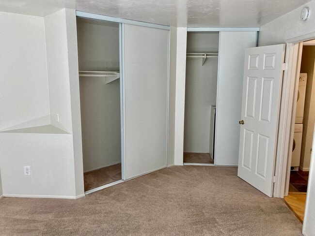 Building Photo - One Bedroom with Garage and IN-Unit laundry in Resort-Style Complex