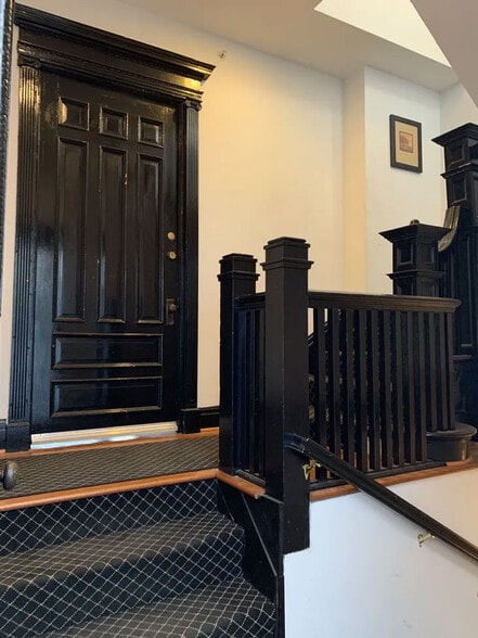 Foyer of apartment; Stairs to right lead to second and third floor apartments. - 485 Elmwood Ave