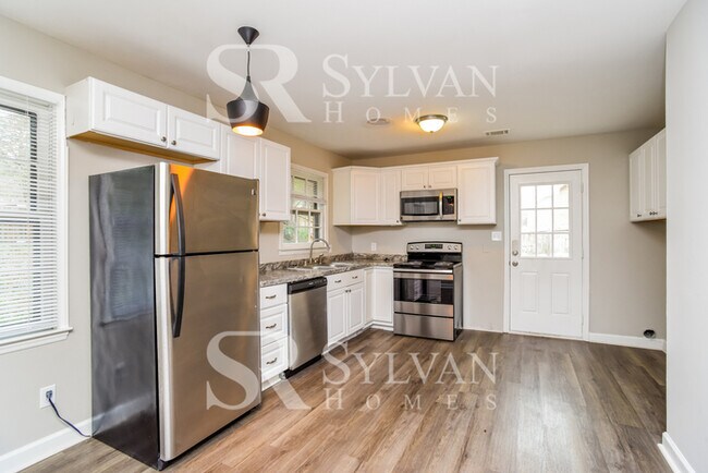 Building Photo - You'll love this charming brick home!