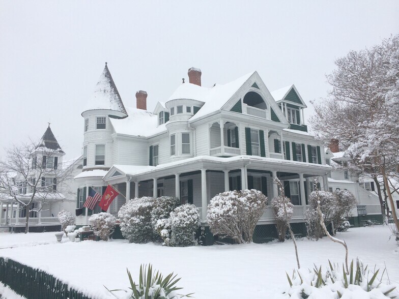 In Winter with snow. Known as Camelot Hall - 701 Locust St