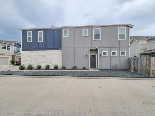 Building Photo - A true gem on a quiet corner lot, this spacious and sun-filled home is tucked away from street no...