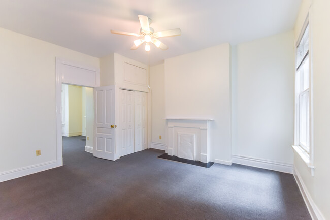 Large bedroom with large closets and ceiling fans - 1617 W Grace St