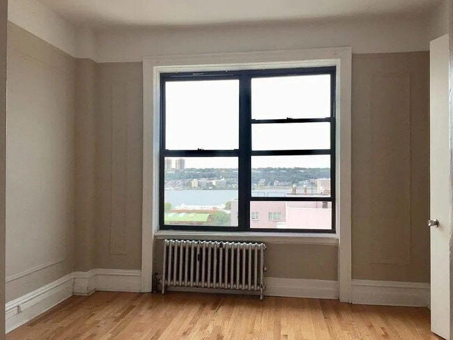 Building Photo - "Charming 1-Bedroom Retreat in Vibrant New York Locale – Your Perfect Urban Sanctuary!"