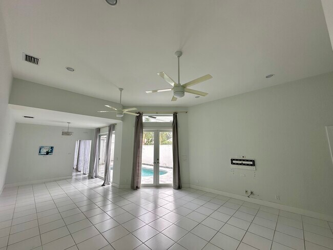 Living room and dining room without furniture - 3656 Mykonos Ct