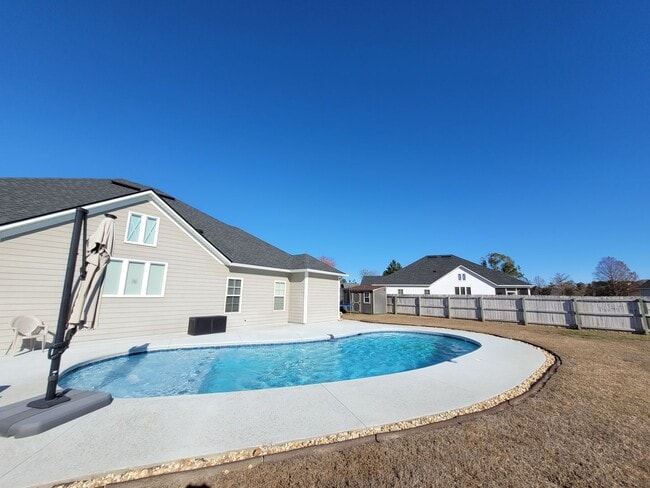 Building Photo - Spacious 4BR Home with Inground Pool, Open Split Floor Plan & Side-Entry Garage