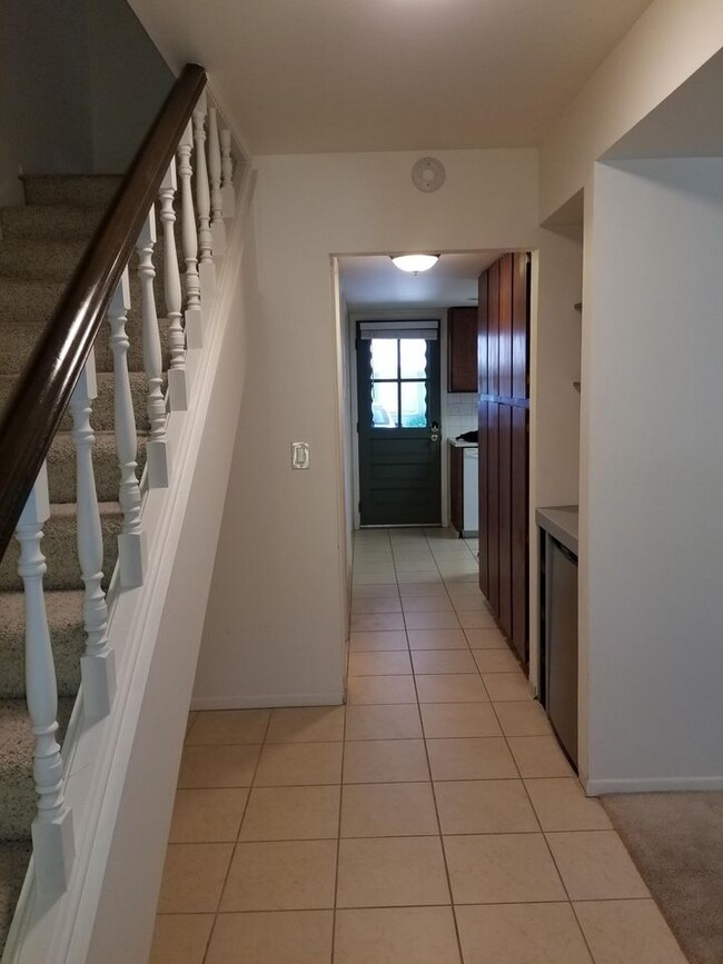 Downstairs Hallway With Half Bath and Dry Bar - 1818 Indian Meadows Ln