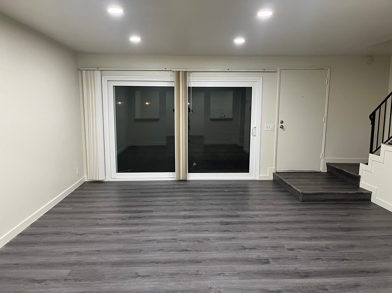 Living looking at Patio door with dimmable resessed lights - 1103 W Francis St