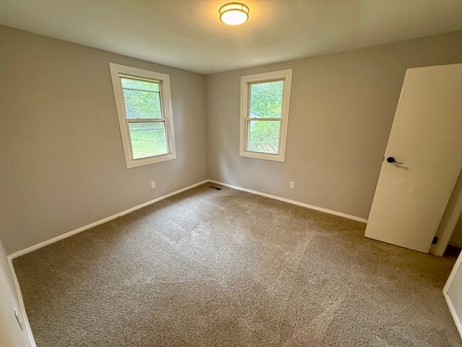 Building Photo - Brick Home with Fenced Yard!