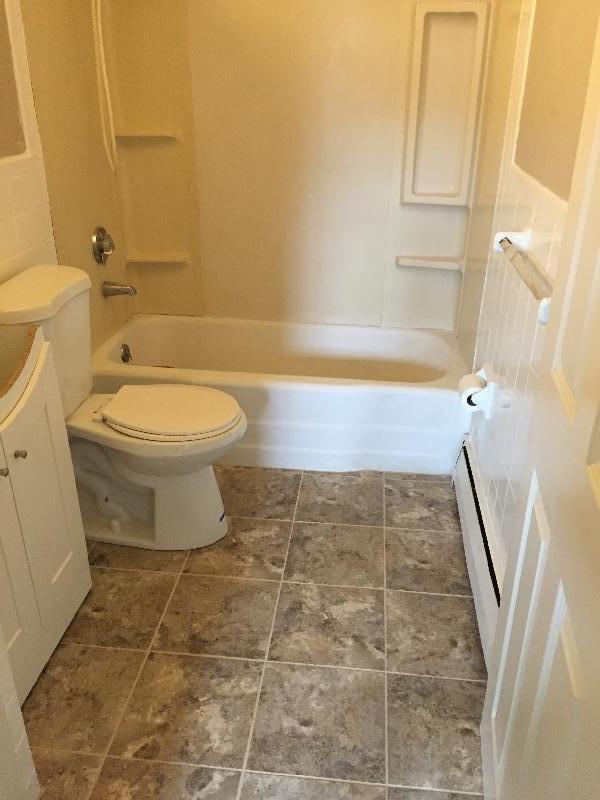 Full bathroom with tub/shower/tiled flooring - 32 Pond St