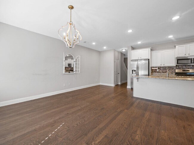 Building Photo - **MOVE IN SPECIAL! 50% off first month's rent!!** Spacious 4BR Townhouse with 2-Car Garage Near D...