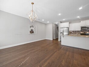 Building Photo - **MOVE IN SPECIAL! 50% off first month's rent!!** Spacious 4BR Townhouse with 2-Car Garage Near D...