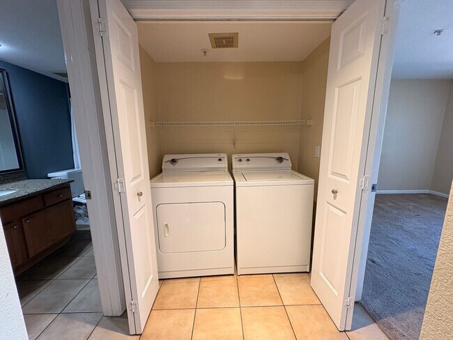 Building Photo - 1BR Condo with Private Balcony, Central A/C & Community Amenities in Corona